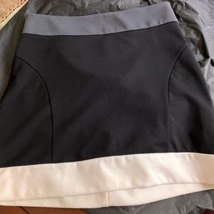Black and off white black mini skirt.